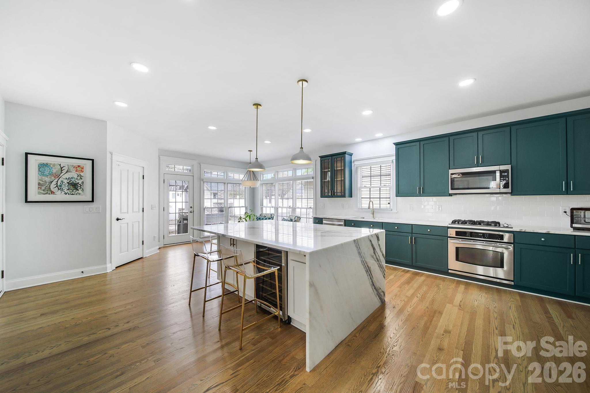 882 Promenade Walk Fort Mill, SC 29708 - Photo 9 of 48 a large kitchen with lots of counter space a sink and appliances