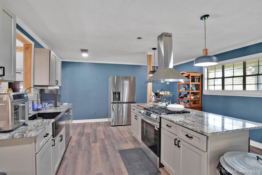 1100 Chipper Lane Keithville, LA 71047 - Photo 11 of 28 a kitchen with stainless steel appliances granite countertop a sink stove and refrigerator