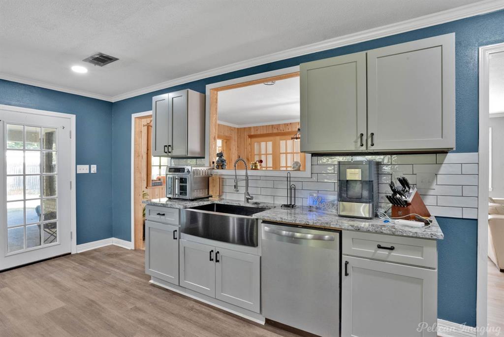 1100 Chipper Lane Keithville, LA 71047 - Photo 13 of 28 a kitchen with stainless steel appliances granite countertop a sink stove and refrigerator