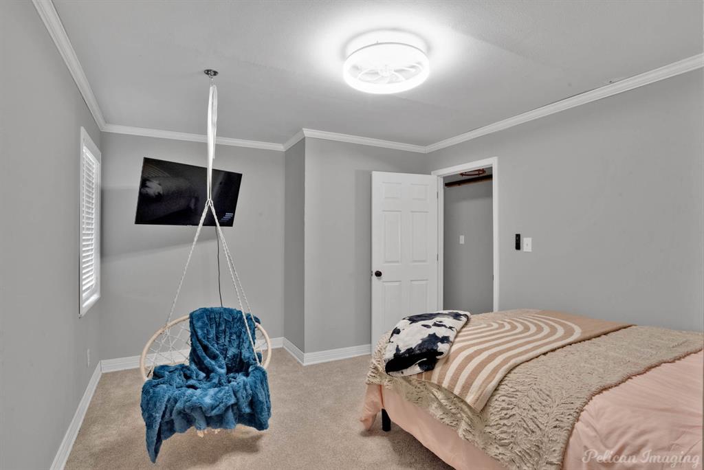 1100 Chipper Lane Keithville, LA 71047 - Photo 20 of 28 a bedroom with a bed window and a mirror