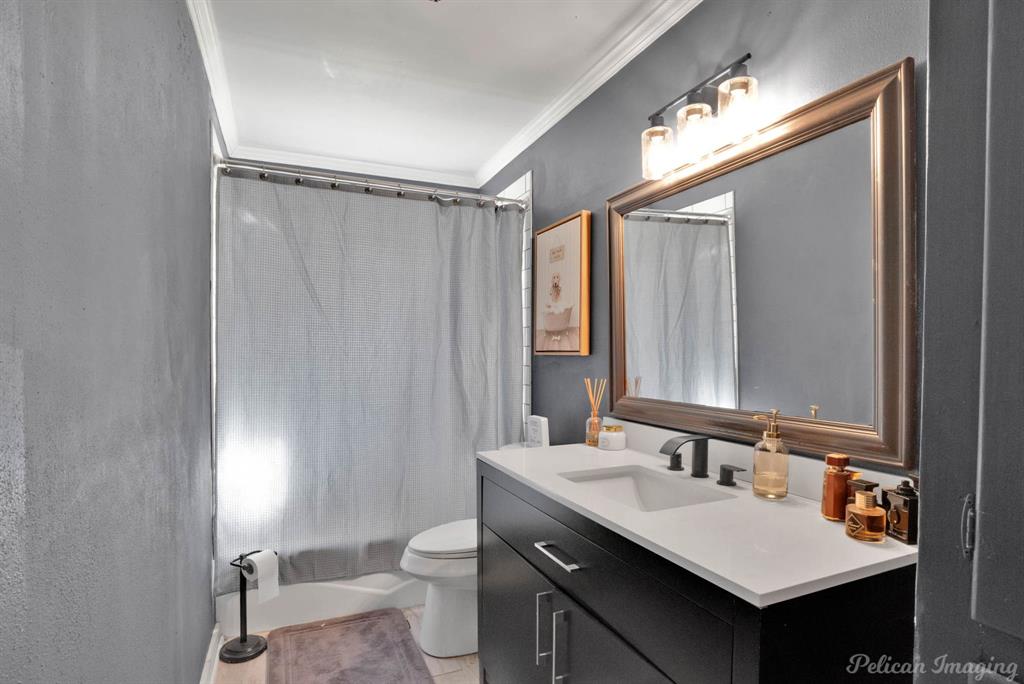1100 Chipper Lane Keithville, LA 71047 - Photo 22 of 28 a bathroom with a sink mirror vanity and toilet