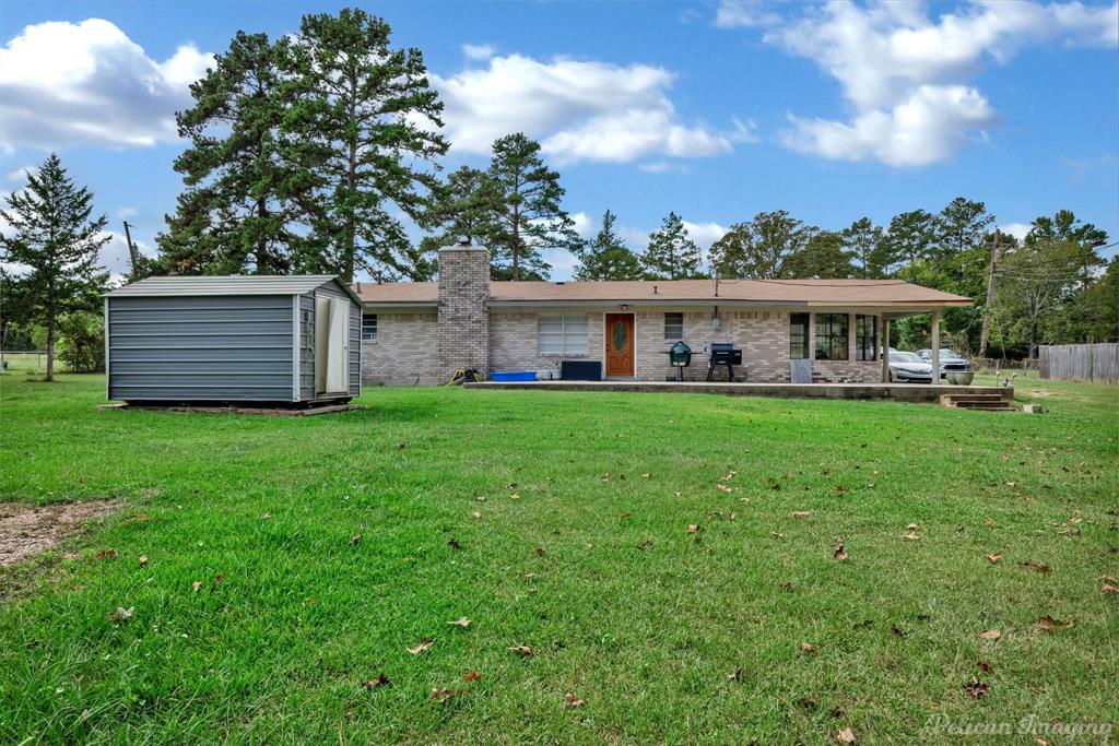1100 Chipper Lane Keithville, LA 71047 - Photo 24 of 28 a view of a house with a yard and sitting area