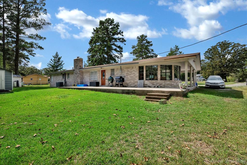 1100 Chipper Lane Keithville, LA 71047 - Photo 25 of 28 a house view with swimming pool and garden view