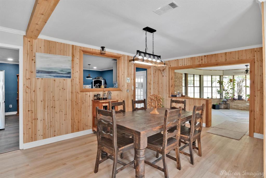 1100 Chipper Lane Keithville, LA 71047 - Photo 7 of 28 a dining room with furniture window and wooden floor