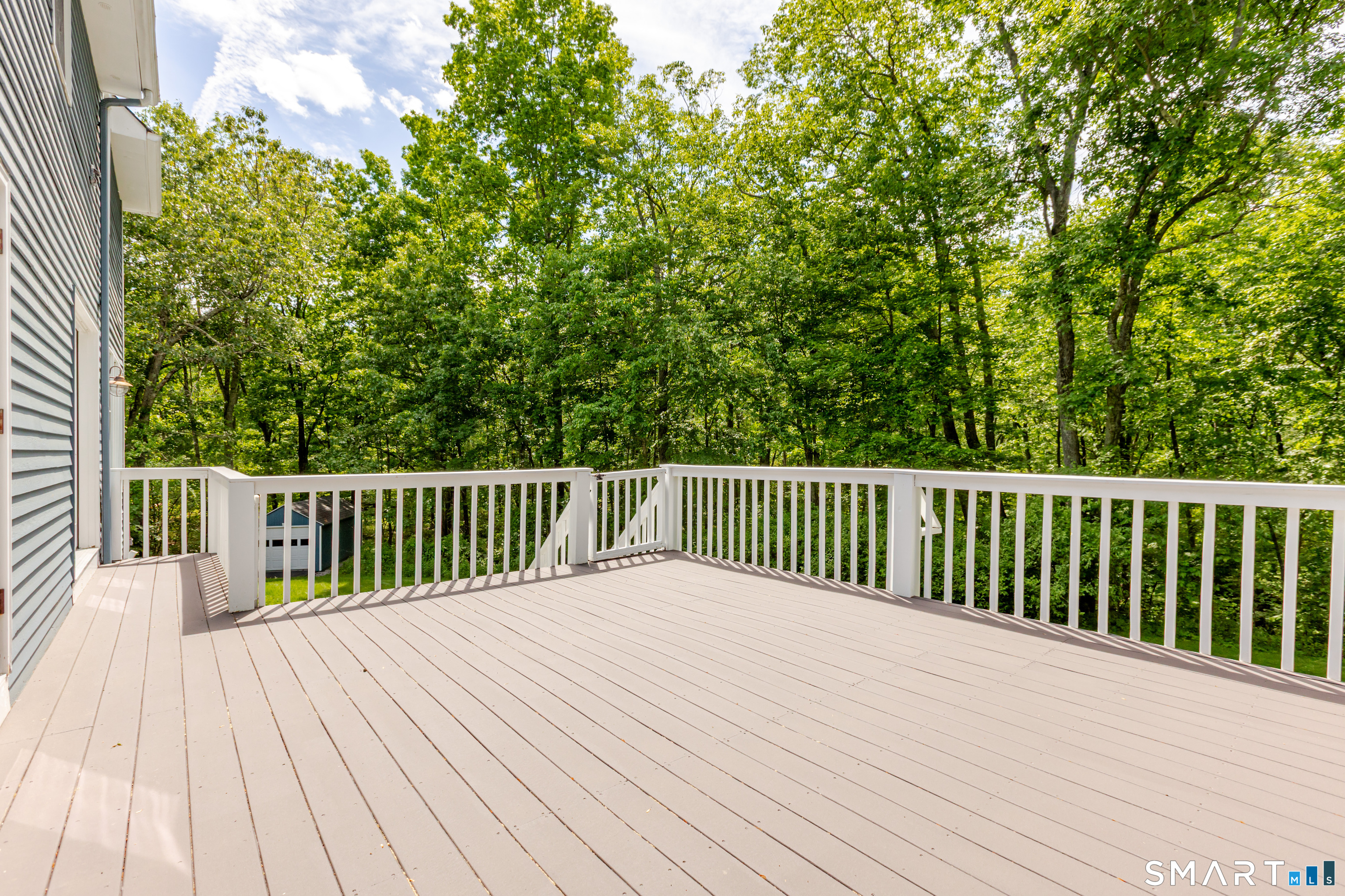 3 Partridge Trail Sherman, CT 06784 - Photo 8 of 37 a balcony with view of a wooden bridge