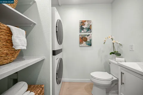 a white toilet sitting next to a bathroom sink