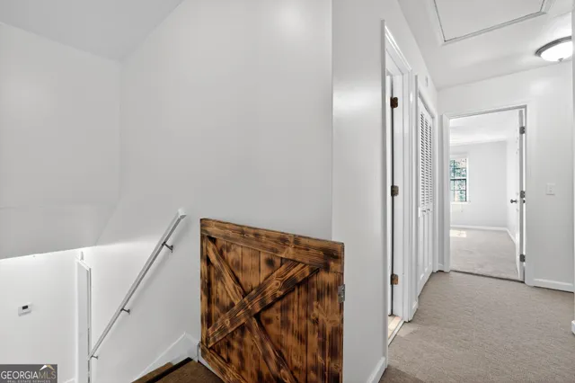 a view of a hallway with closet area