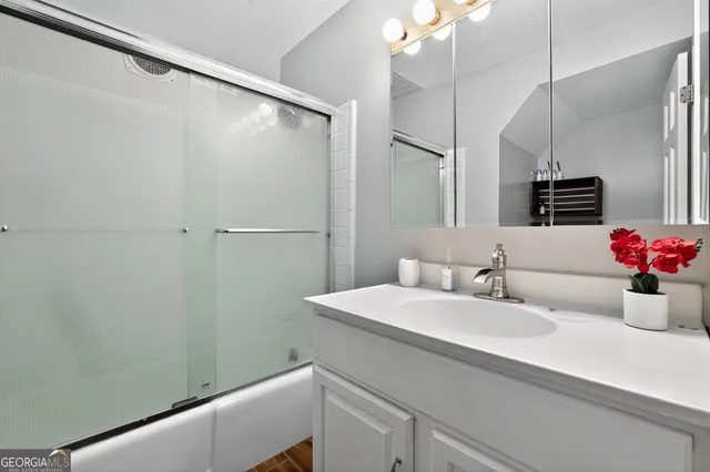 a bathroom with a sink and a mirror