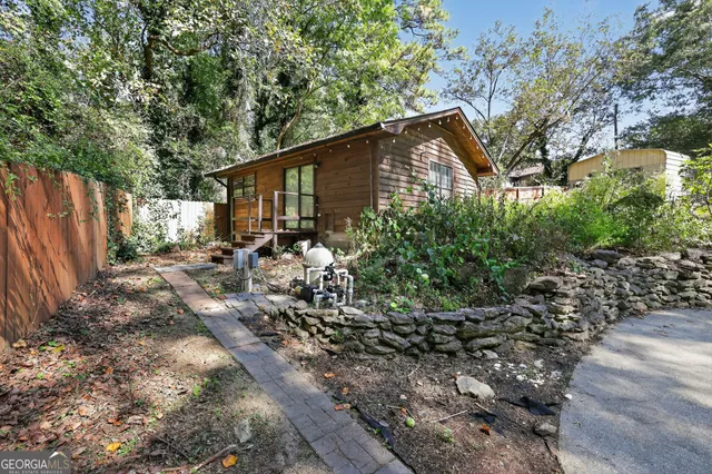 a backyard of a house with lots of green space