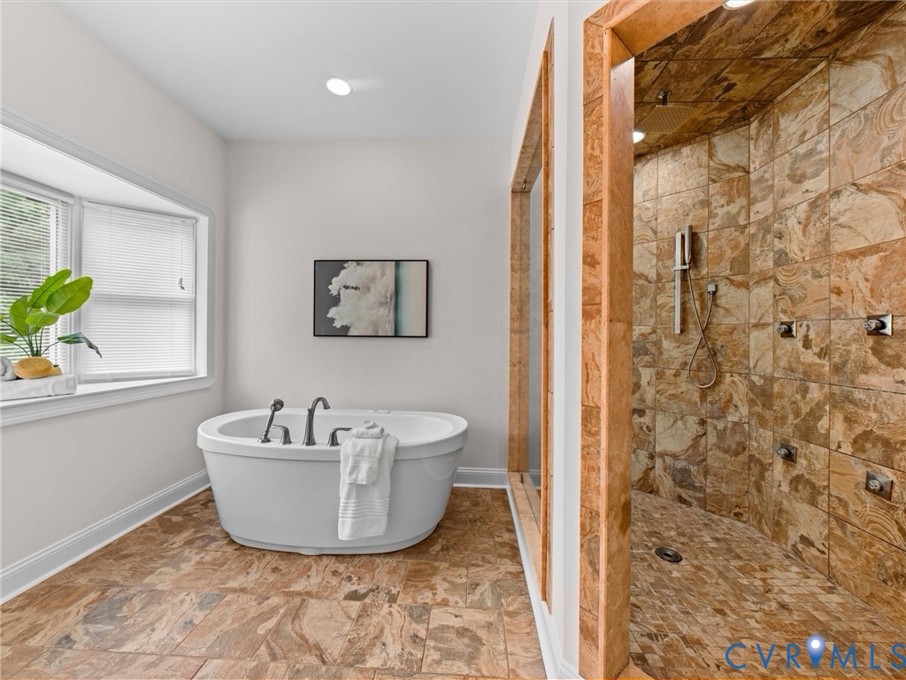 1700 Tigers Road Manakin-Sabot, VA 23103 - Photo 41 of 64 a spacious bathroom with a bathtub and shower