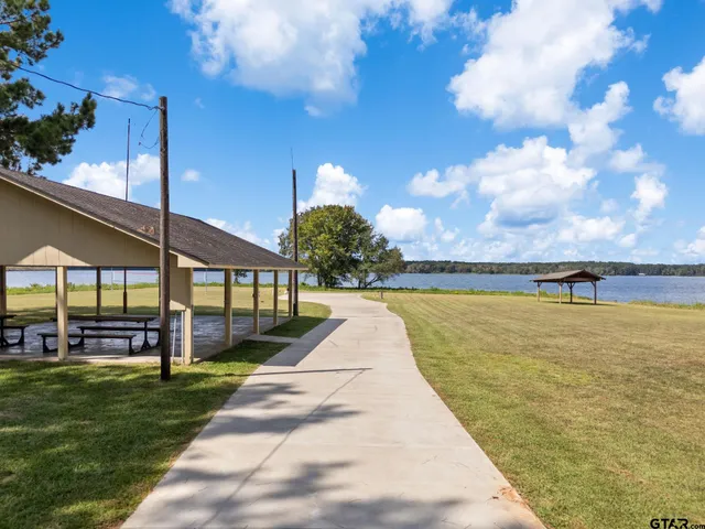 a view of swimming pool with seating area