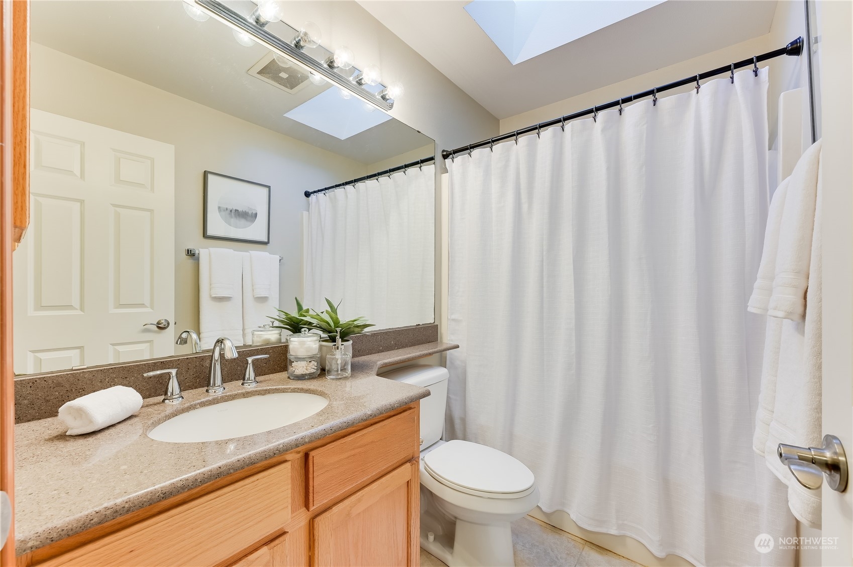 2201 192nd Street Southeast, Unit C3 Bothell, WA 98012 - Photo 20 of 26 a bathroom with a granite countertop sink and a mirror