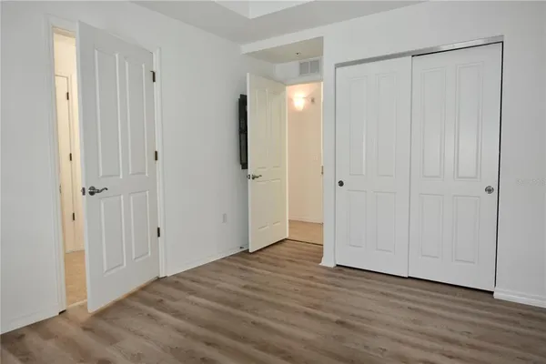 a kitchen with granite countertop white cabinets white stainless steel appliances with a sink and dishwasher