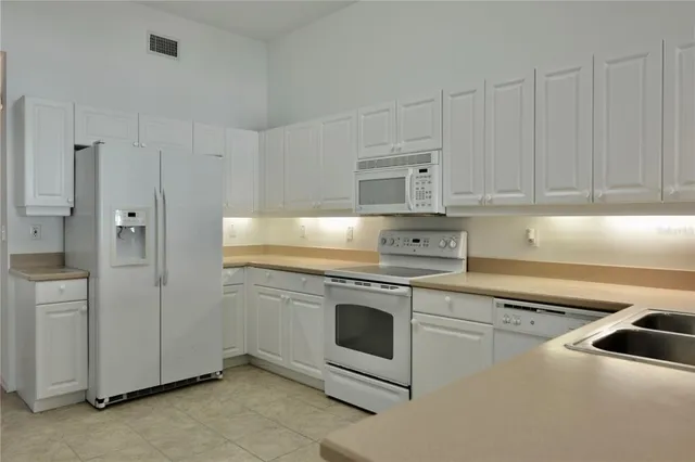 a living room with furniture fireplace and a flat screen tv