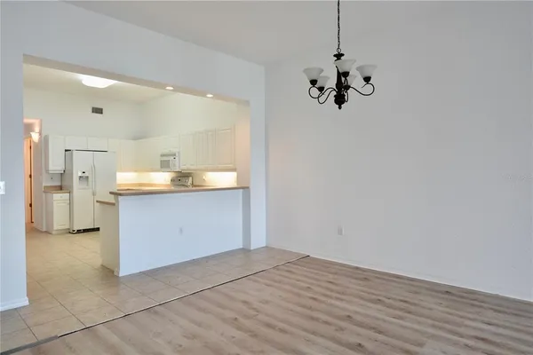 an empty room with closet and wooden floor