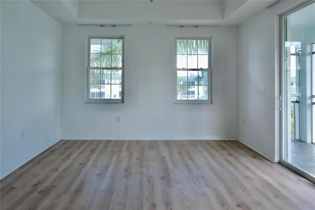 a bath tub sitting in a bathroom next to a window