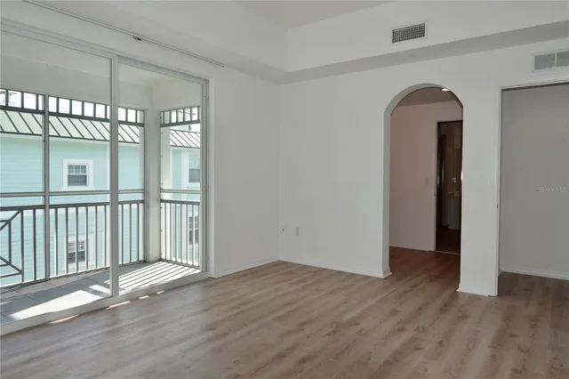 a view of a hallway with wooden shelves