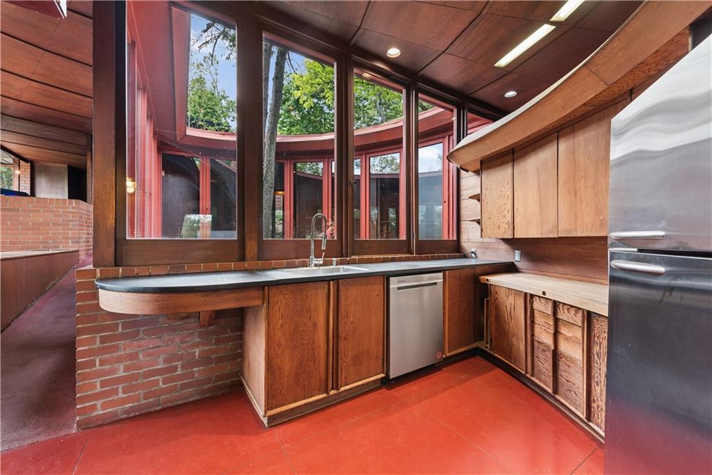 5139 Penton Road Pittsburgh, PA 15213 - Photo 14 of 32 a kitchen with stainless steel appliances granite countertop a sink and a stove