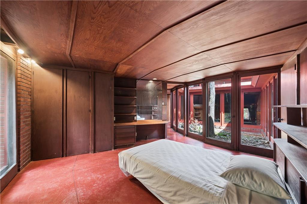 5139 Penton Road Pittsburgh, PA 15213 - Photo 22 of 32 a bedroom with a bed window and a walk in closet