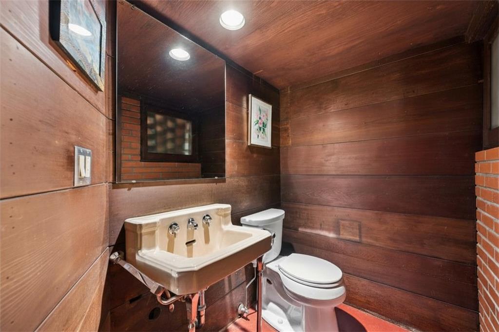 5139 Penton Road Pittsburgh, PA 15213 - Photo 5 of 32 a bathroom with a sink a toilet and a mirror