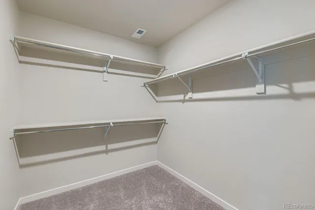 a view of an empty walk in closet