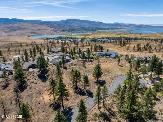 a view of a town with mountains in the background