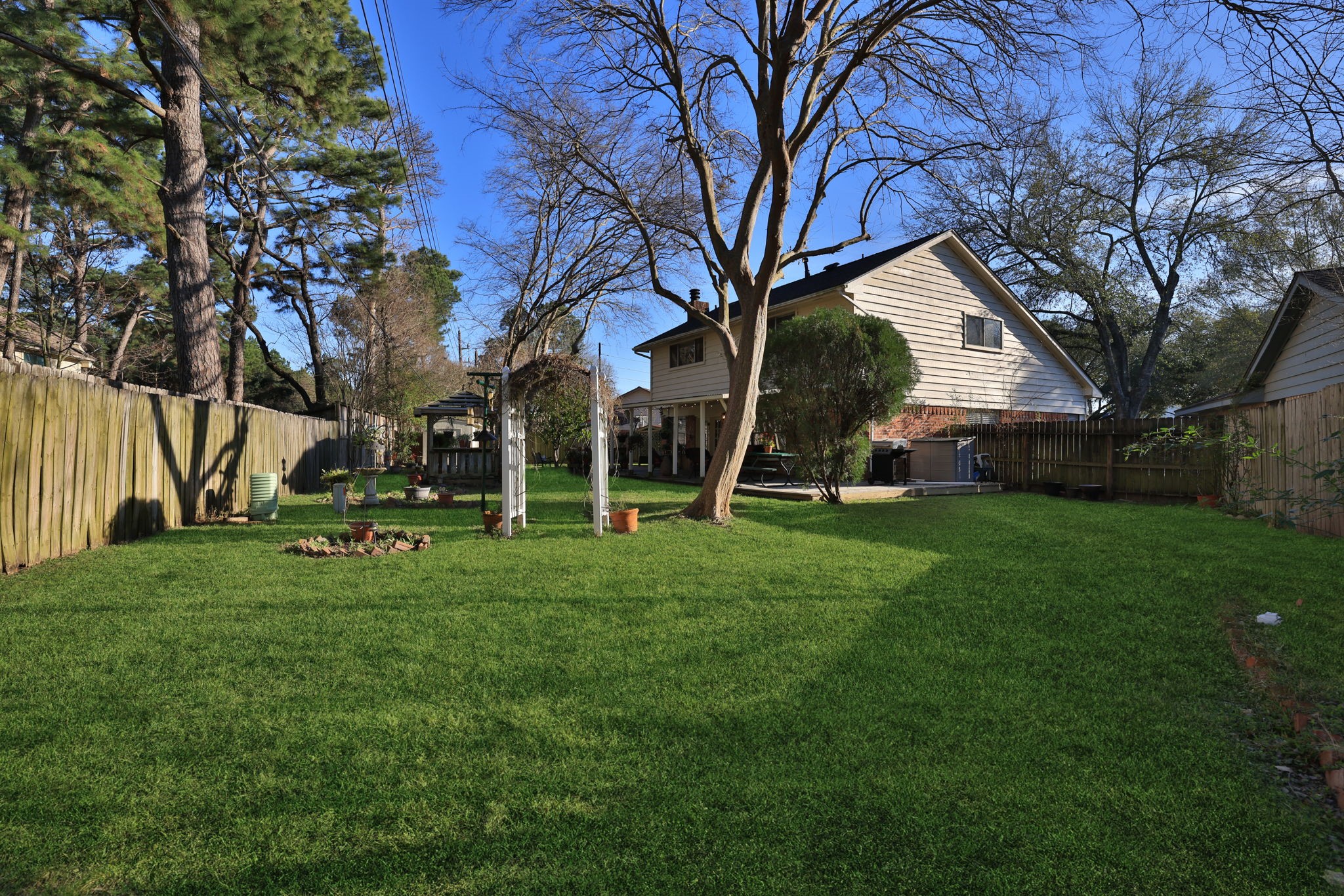 9102 Woodhouse Drive Spring, TX 77379 - Photo 27 of 32 BACK YARD - Such a great back yard with so much space. Great for kids and pets to play. Plenty of room for a pool too.