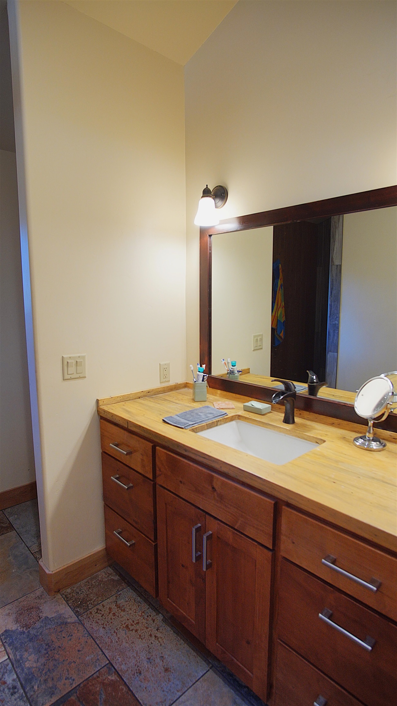 1557 Alpine Meadows Road Alpine Meadows, CA 96146 - Photo 28 of 28 a bathroom with a granite countertop sink and a mirror