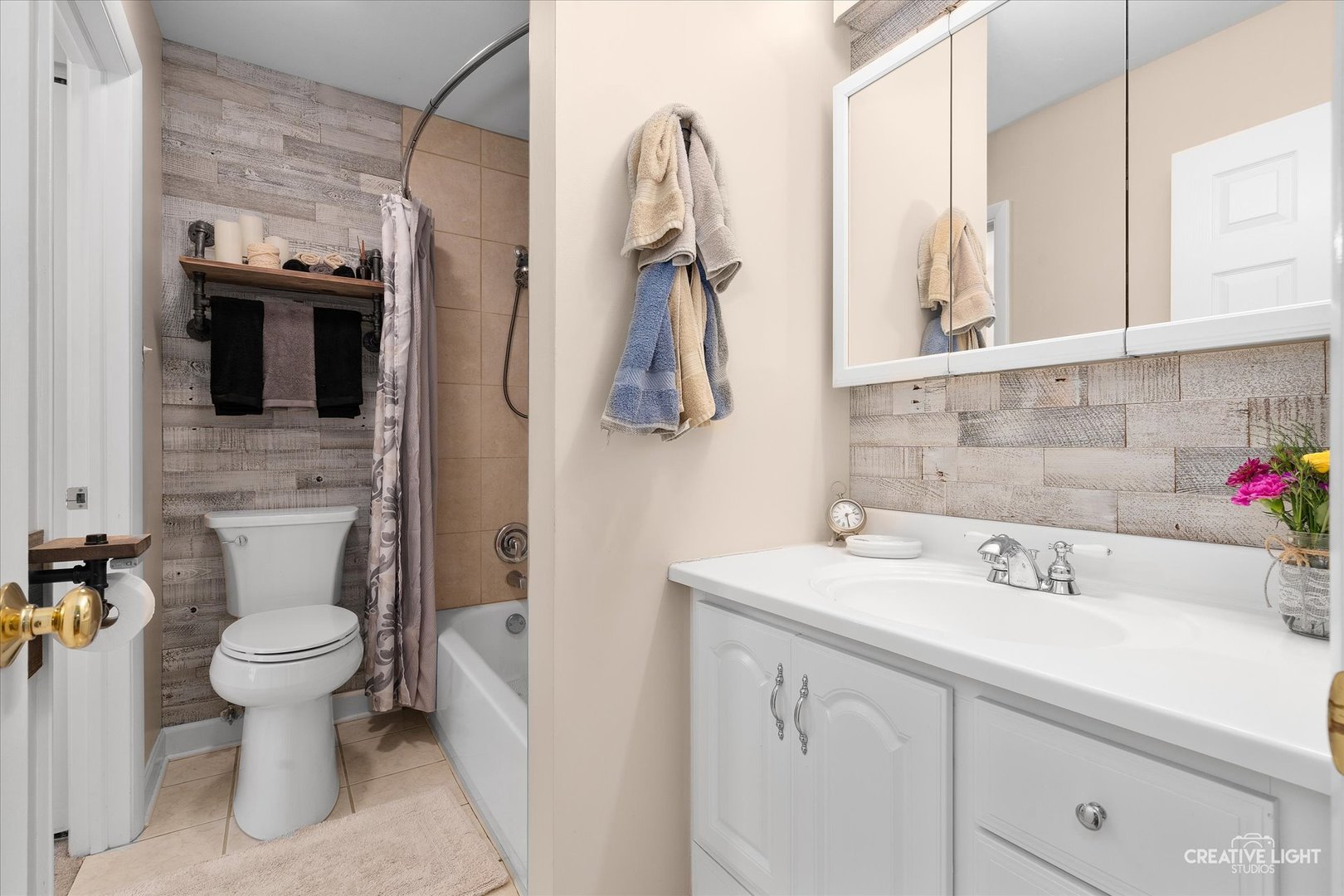 1703 Lakecliffe Drive, Unit D Wheaton, IL 60189 - Photo 14 of 20 a bathroom with a sink toilet and shower