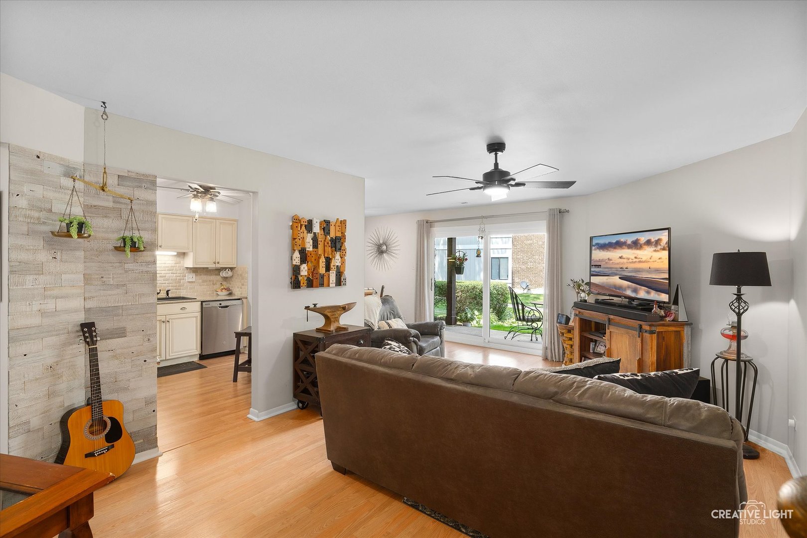 1703 Lakecliffe Drive, Unit D Wheaton, IL 60189 - Photo 4 of 20 a living room with furniture and a flat screen tv