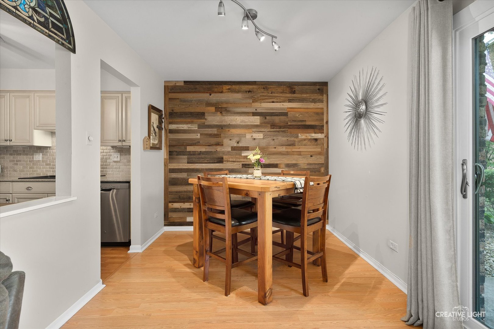 1703 Lakecliffe Drive, Unit D Wheaton, IL 60189 - Photo 7 of 20 a dining room with furniture and window