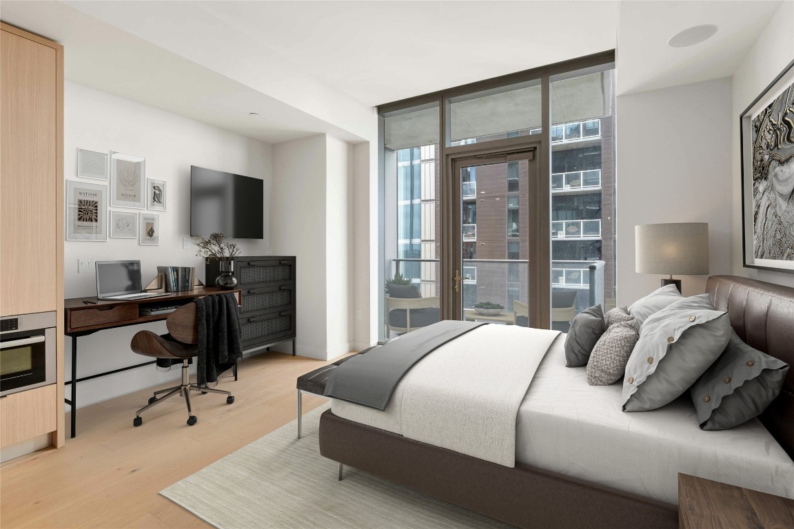 a bedroom with a bed and a desk