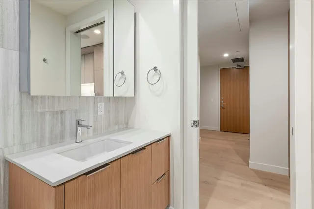 a bathroom with a sink a toilet and bathtub