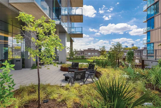 a view of balcony with outdoor space and lake view