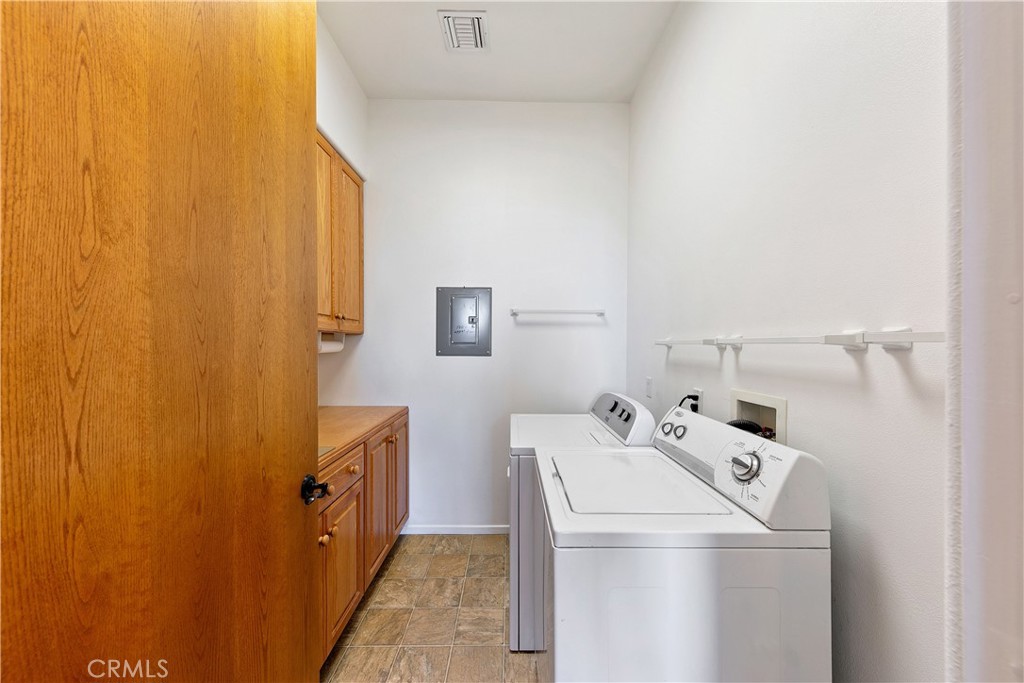 8400 Mipolomol Road Malibu, CA 90265 - Photo 20 of 58 a utility room with dryer and washer