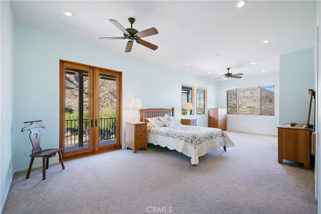 8400 Mipolomol Road Malibu, CA 90265 - Photo 30 of 58 a bed room with a bed and a tv