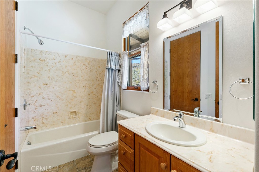 8400 Mipolomol Road Malibu, CA 90265 - Photo 36 of 58 a bathroom with a sink a toilet and shower