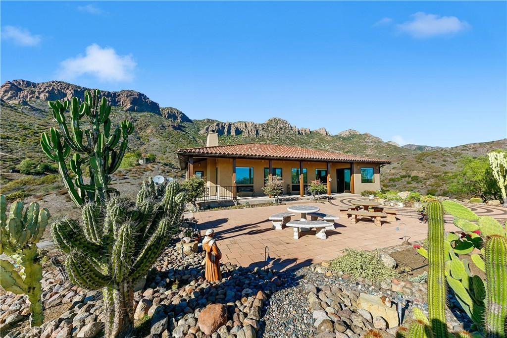 8400 Mipolomol Road Malibu, CA 90265 - Photo 5 of 58 a view of a house with pool and sitting area