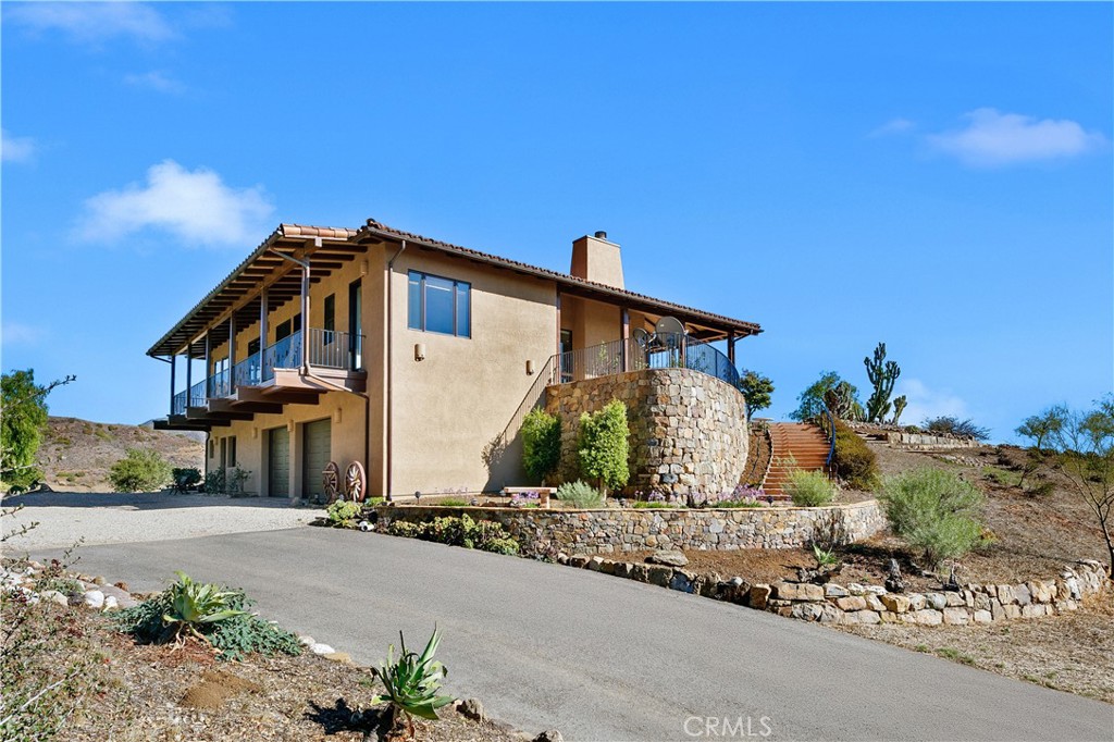 8400 Mipolomol Road Malibu, CA 90265 - Photo 8 of 58 a front view of a house with garden