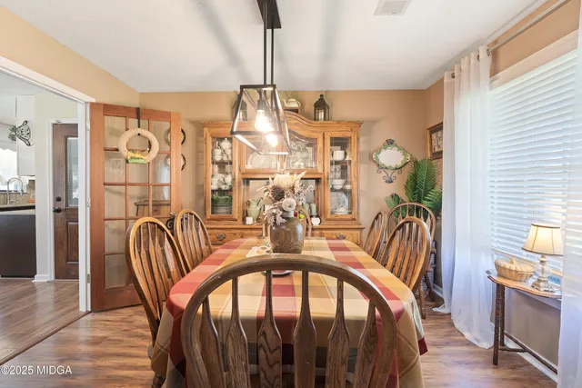 a kitchen with a sink dishwasher and white cabinets