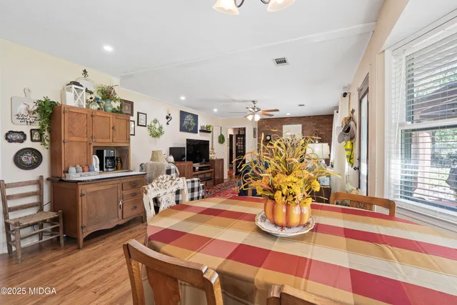 a living room with furniture and flat screen tv