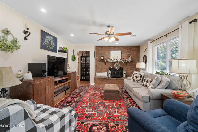 a bedroom with bed and wooden floor