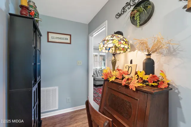 a bedroom with a bed and a dresser in it