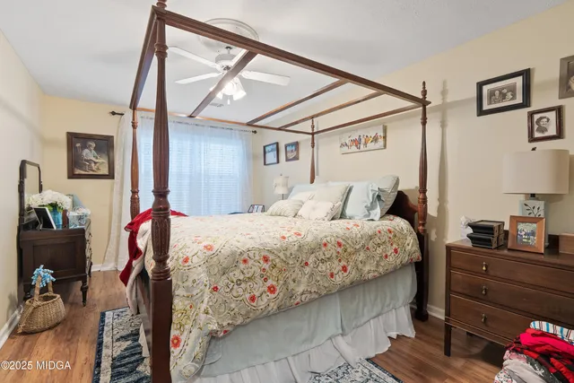 a bed room with a bed and dresser