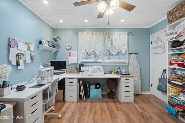 a bathroom with a granite countertop sink a mirror and shower
