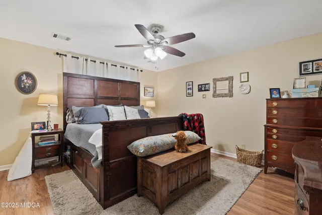 a view of a porch with furniture and a yard