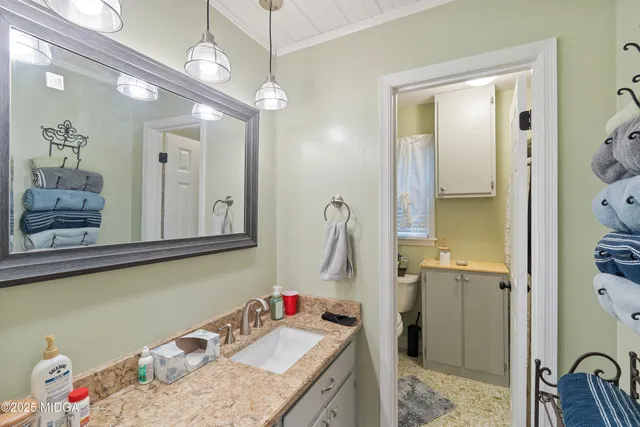 a backyard of a house with table and chairs