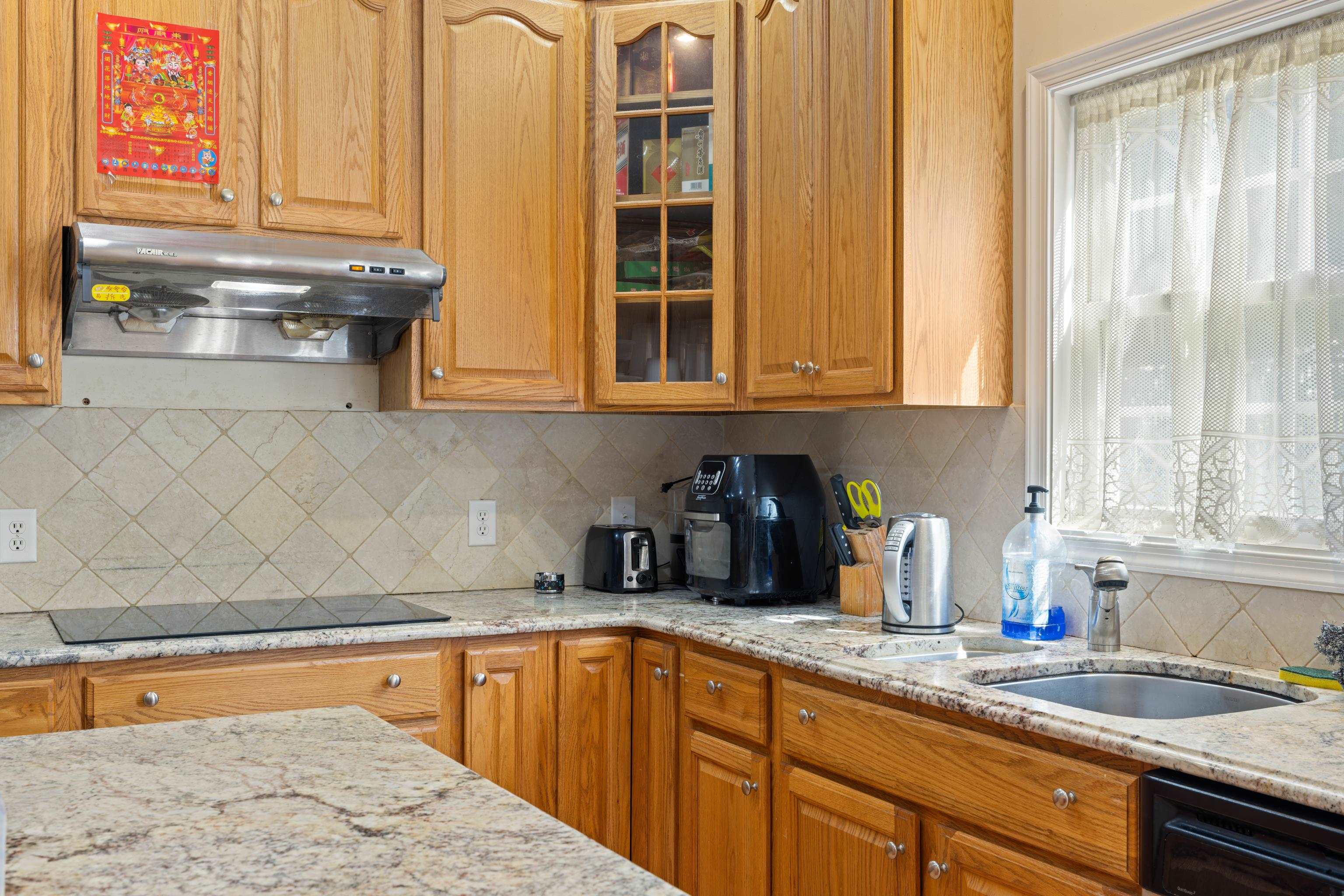 635 Long Meadow Road Fishersville, VA 22939 - Photo 18 of 63 a kitchen with stainless steel appliances granite countertop a sink a stove and cabinets