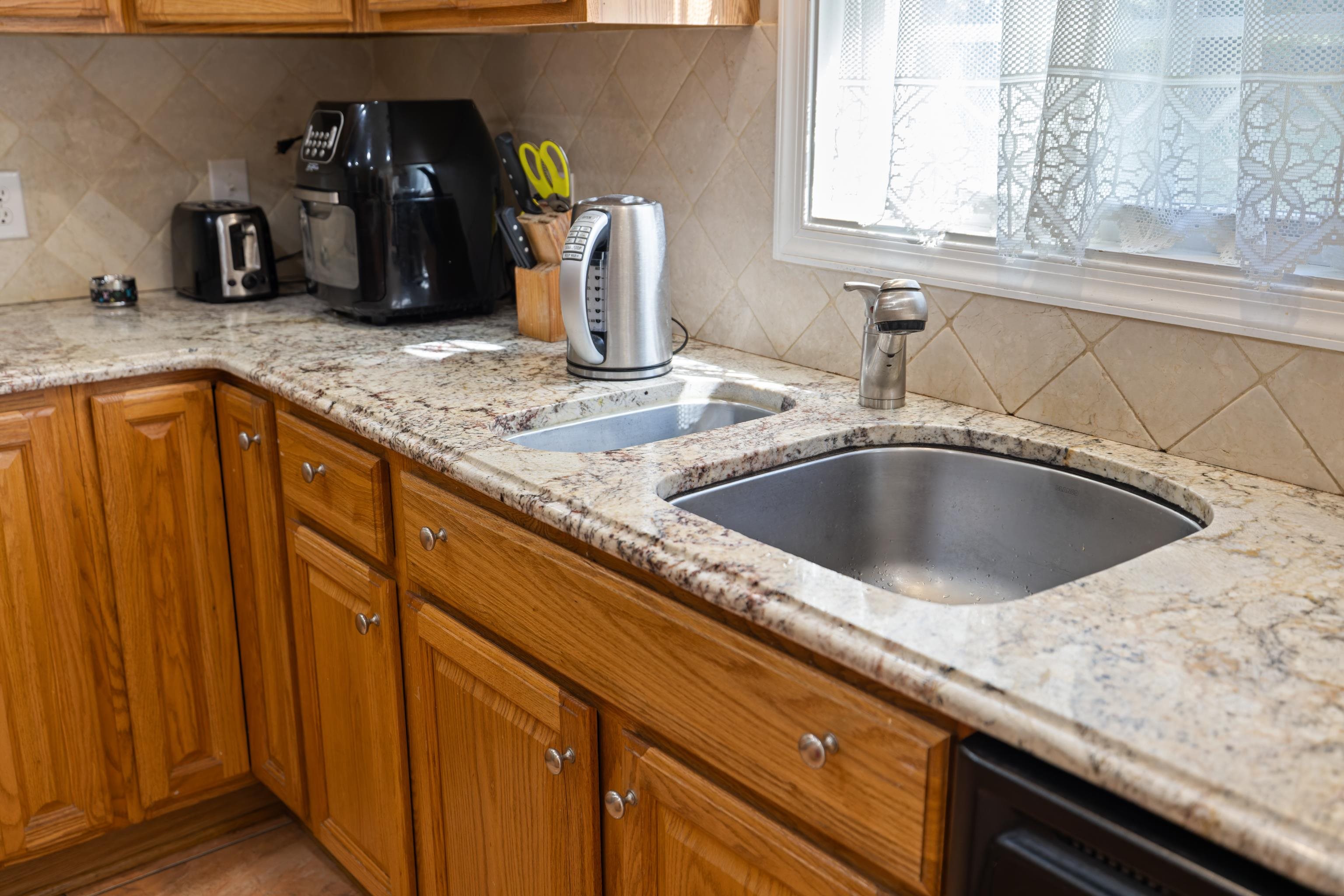 635 Long Meadow Road Fishersville, VA 22939 - Photo 19 of 63 a kitchen with granite countertop a sink and a granite counter tops