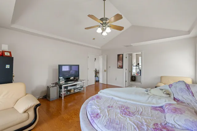 a bathroom with a sink vanity tub and a mirror